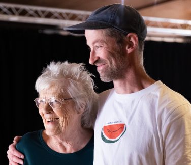 Christine and Robbie embracing one another.