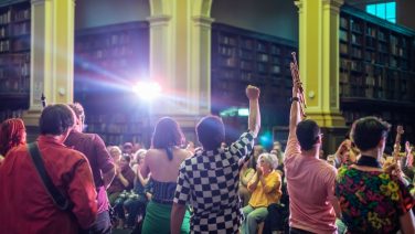 People dancing in a library