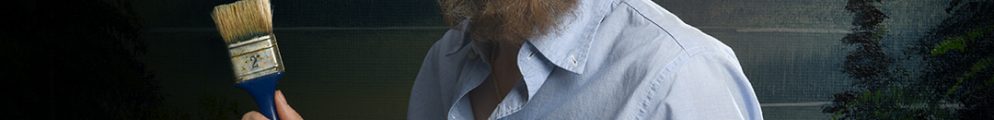 Sarah-Louise Young in costume as Bob Ross, featuring a curly afro wig and beard, holding a paintbrush against a landscape painting background.